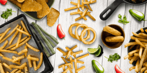 Spread of the frozen foods McCain offers like french fries and chicken nuggets. Showcases the client's products.